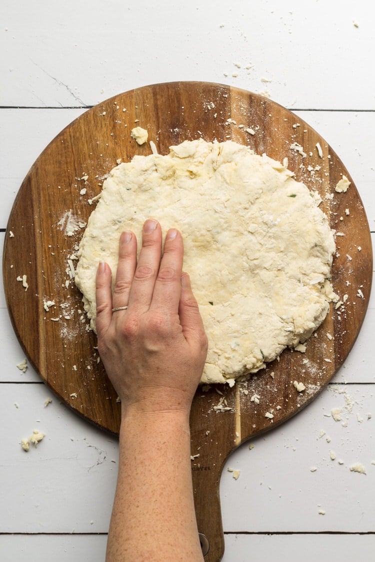 Southern Biscuit Dough rolled out on a wooden board