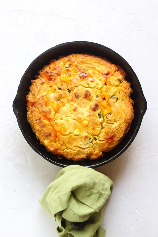 Gluten Free Poblano cheddar cornbread baked in a cast iron skillet