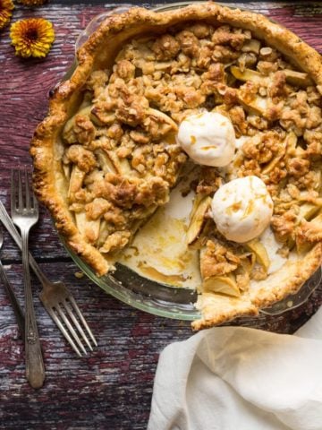 Apple Streusel Pie sliced with vanilla ice cream