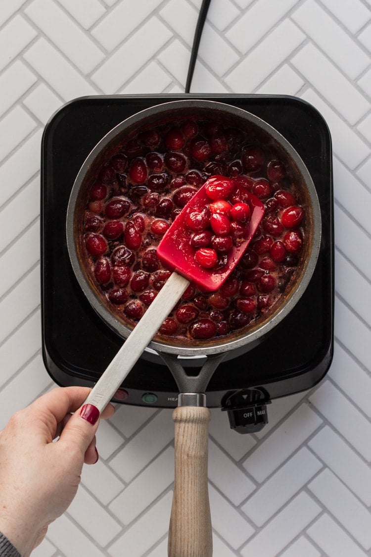 Cranberry sauce simmering in a sauce pan