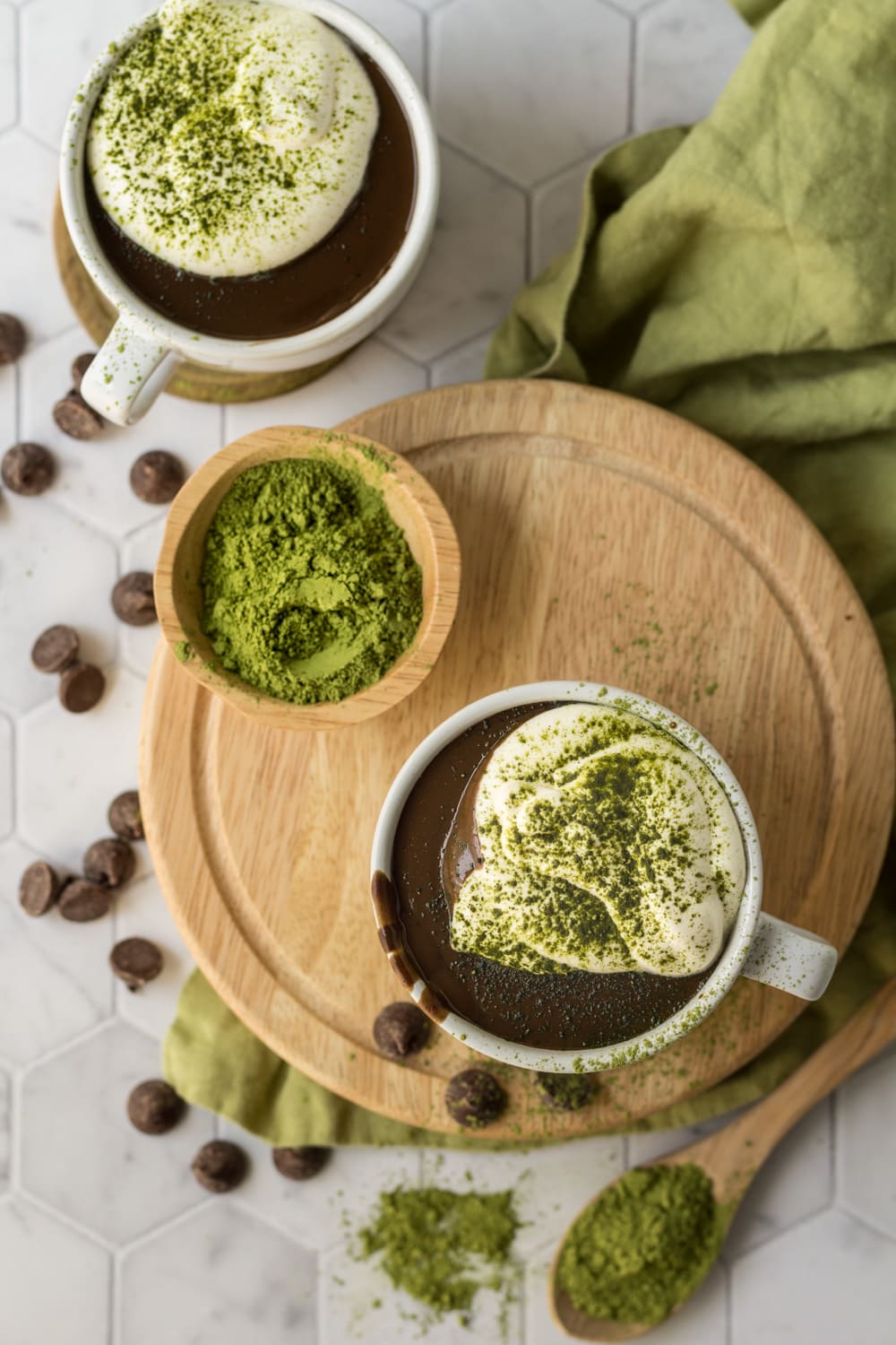 Matcha Hot Chocolate Recipe on a round wood board