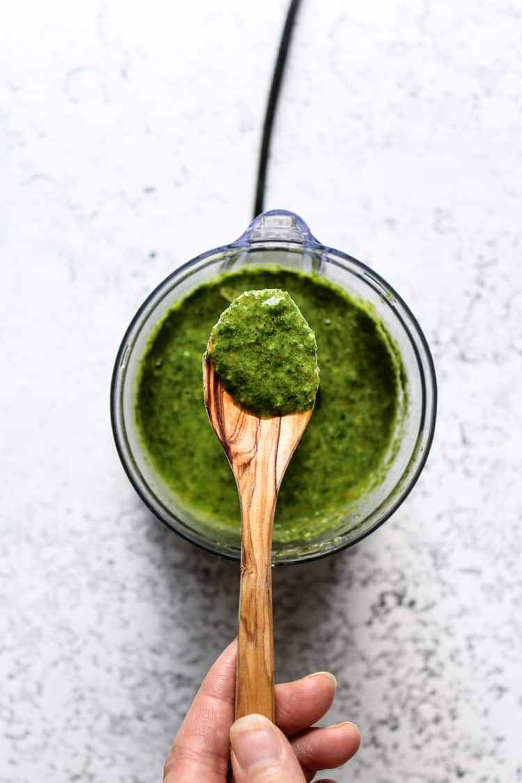 Green chili chimichurri sauce in a spoon