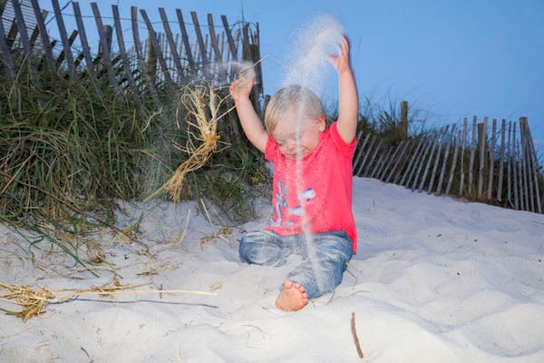 samuel beach playing in sand