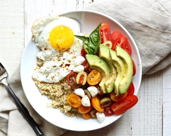 easy quinoa breakfast bowl with fried eggs and avocado