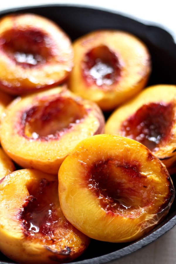 Juicy peaches broiled ready to be topped with coconut cream!