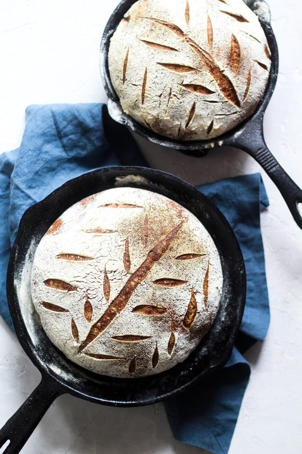 Earthy Soudough Honey Spelt Bread baked in cast iron skillets