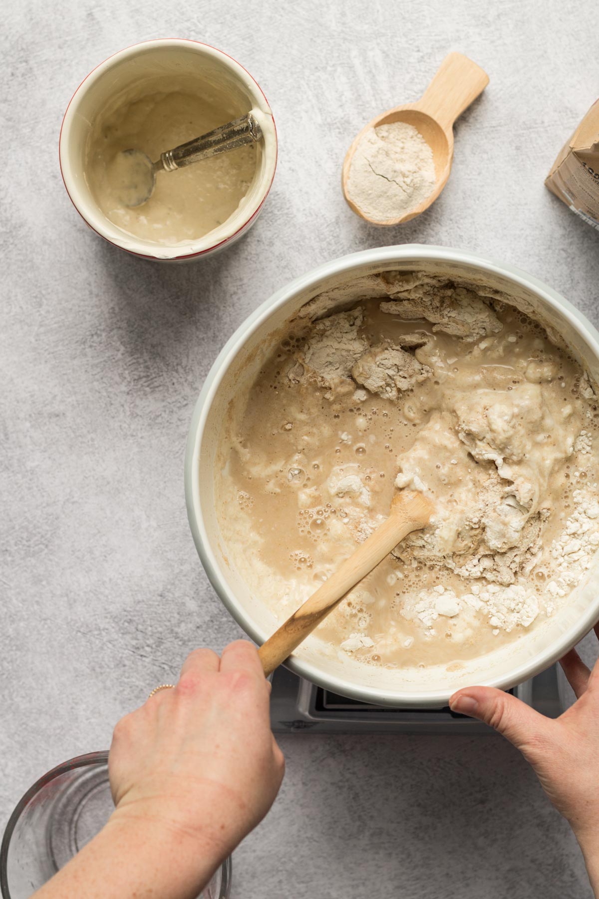 Stirring bread dough in a bowl