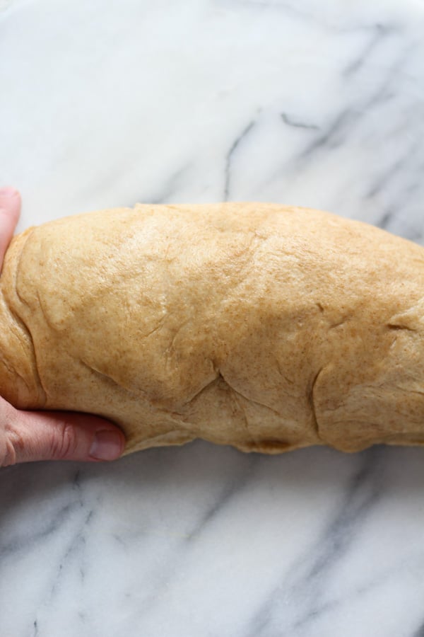 Shaping Sourdough Spelt Brioche Bread in a loaf pan