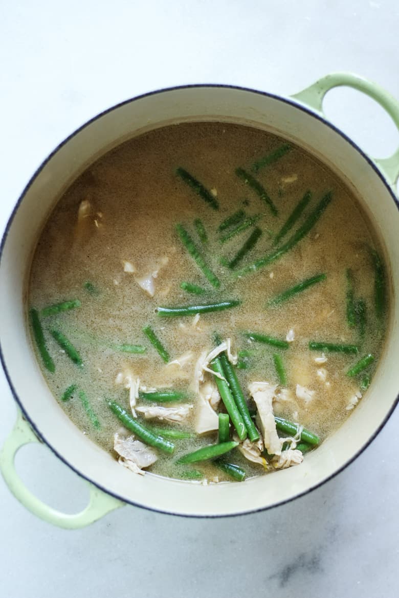 Easy Bone Broth Avgolemeno soup recipe with green beans in a dutch oven