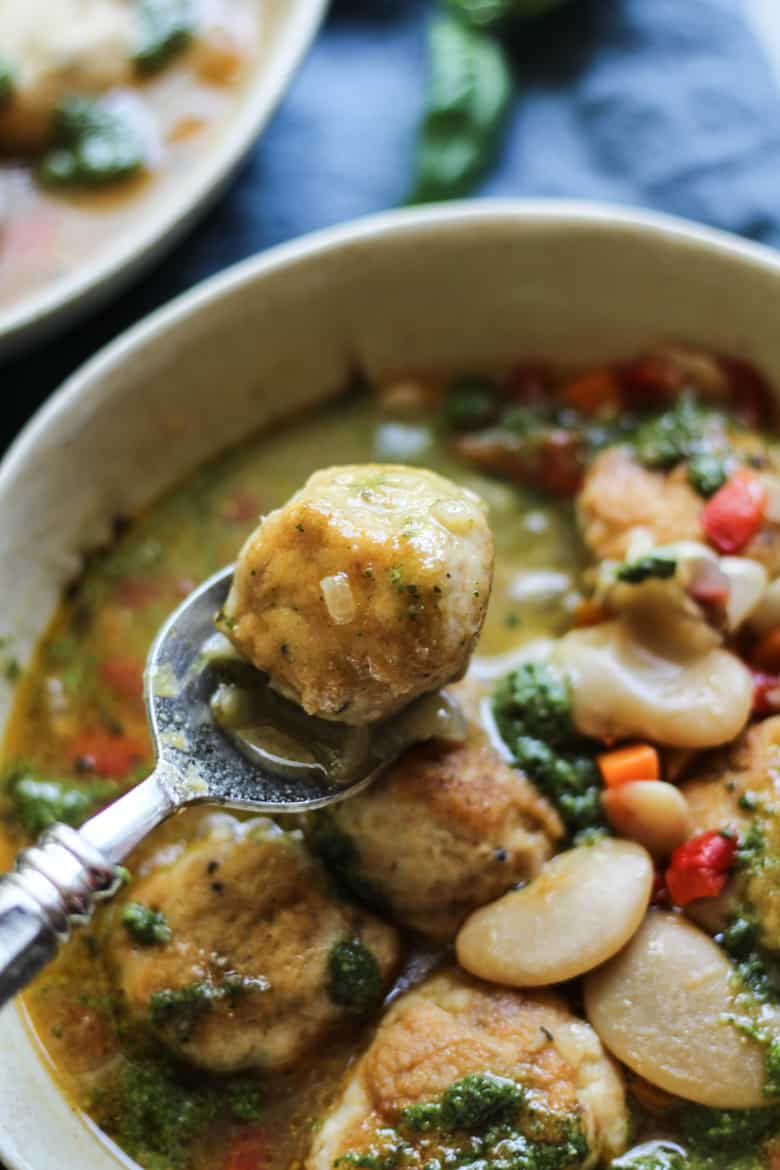 Chicken meatball soup with white beans, bone broth, and pesto