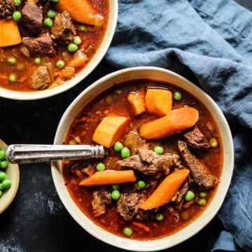 Bone Broth Instant Pot Beef Stew Recipe with carrots, onion, and peas
