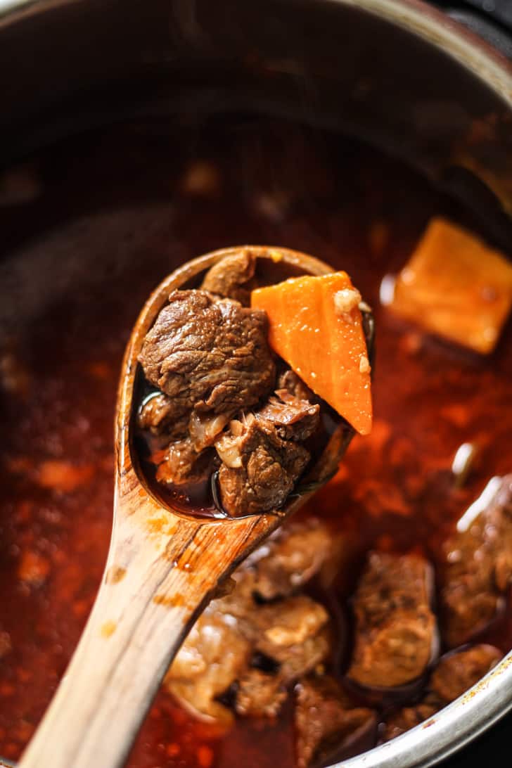 Instant Pot Beef Stew Recipe with carrots, onions, and herbs