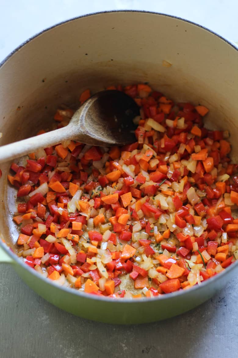 peppers, onions, carrots, and garlic sauteeing for chicken meatball soup