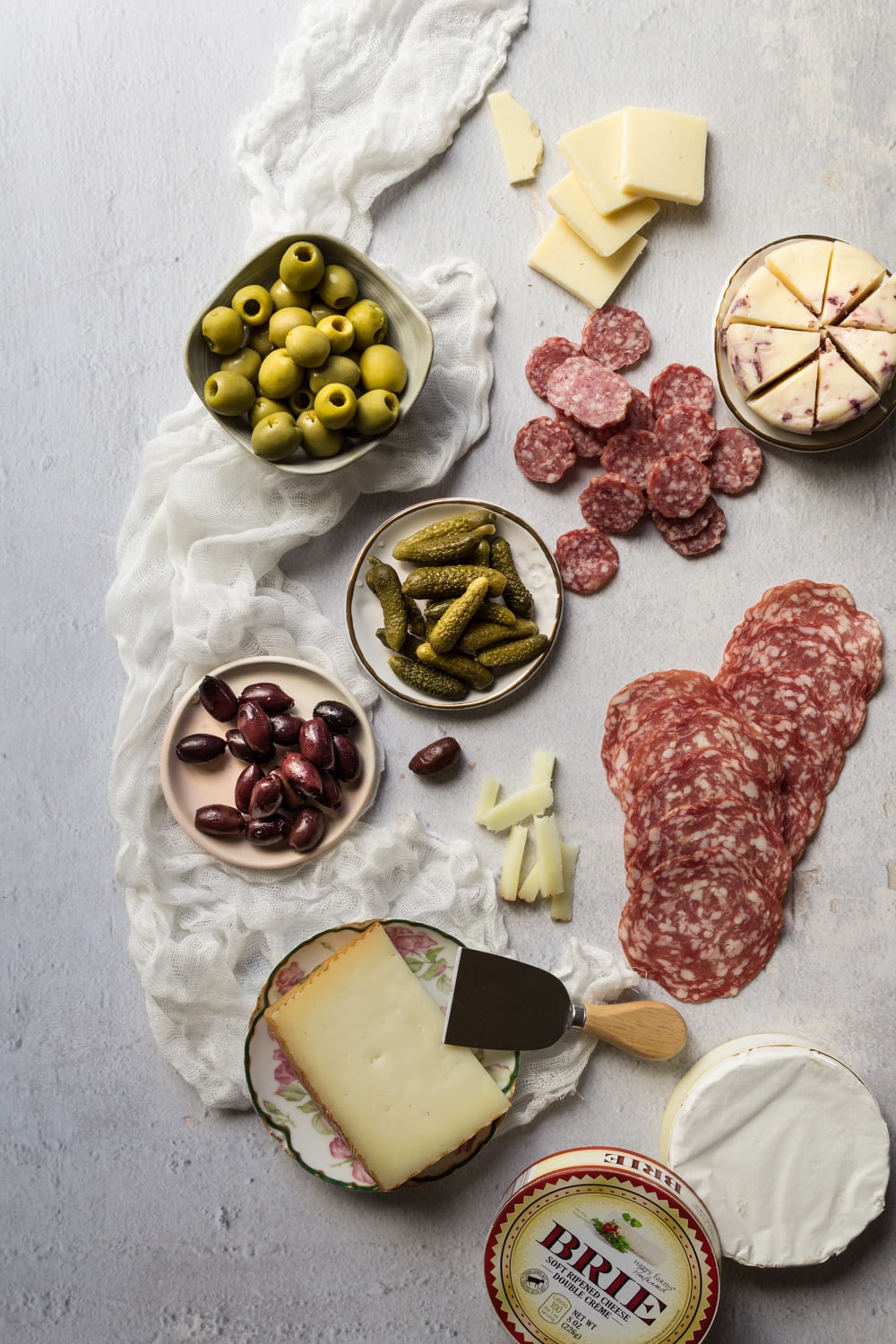 Olives, meats, and cheeses for a charcuterie board