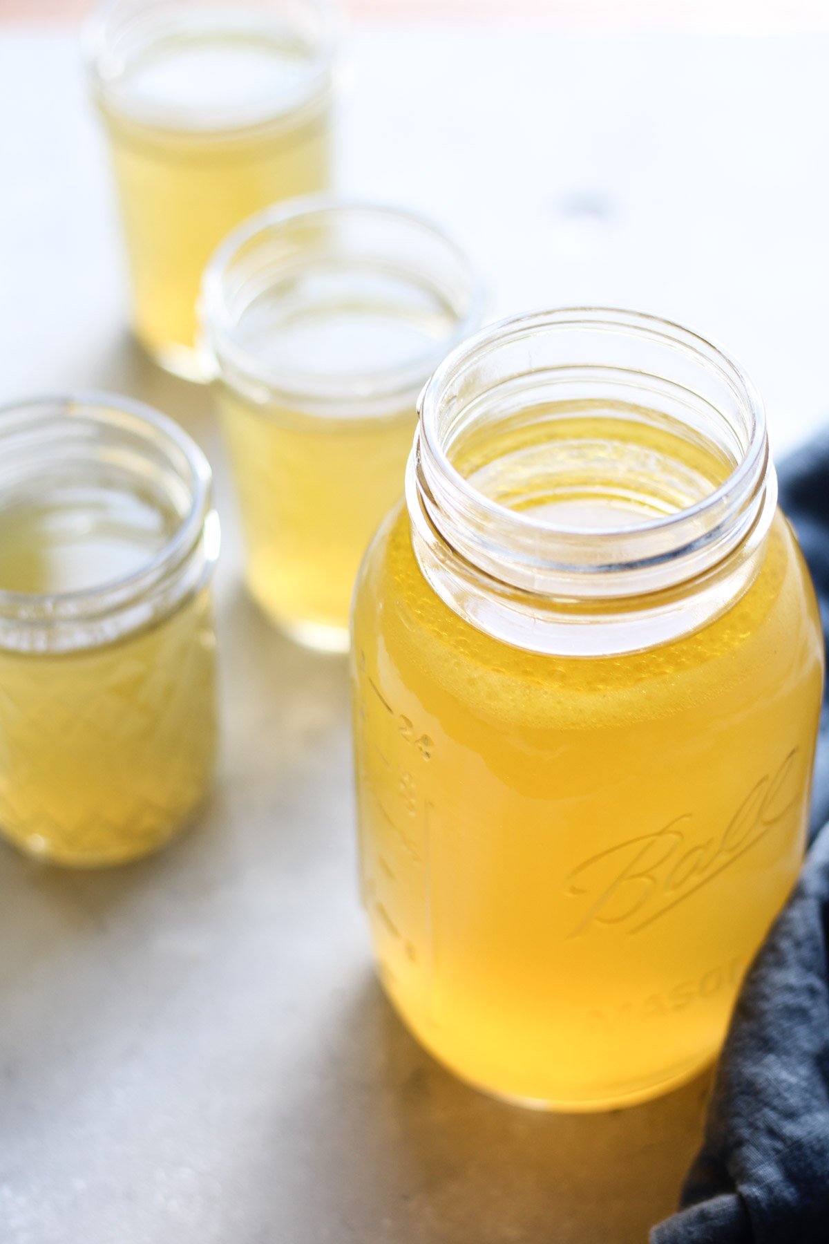 Chicken bone broth in mason jars