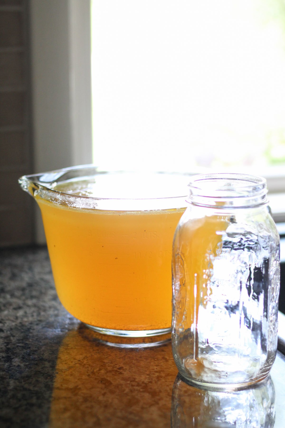 Chicken broth in a large jar