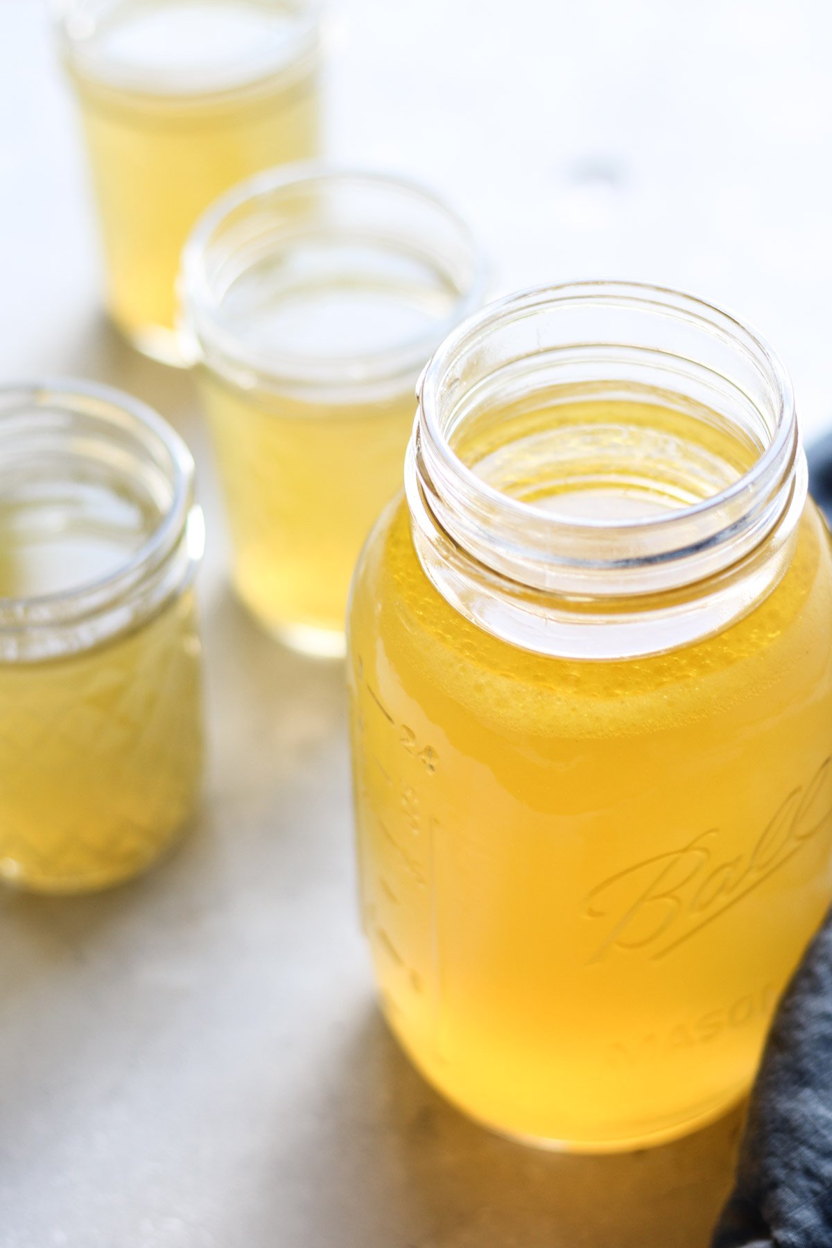 Chicken bone broth in mason jars