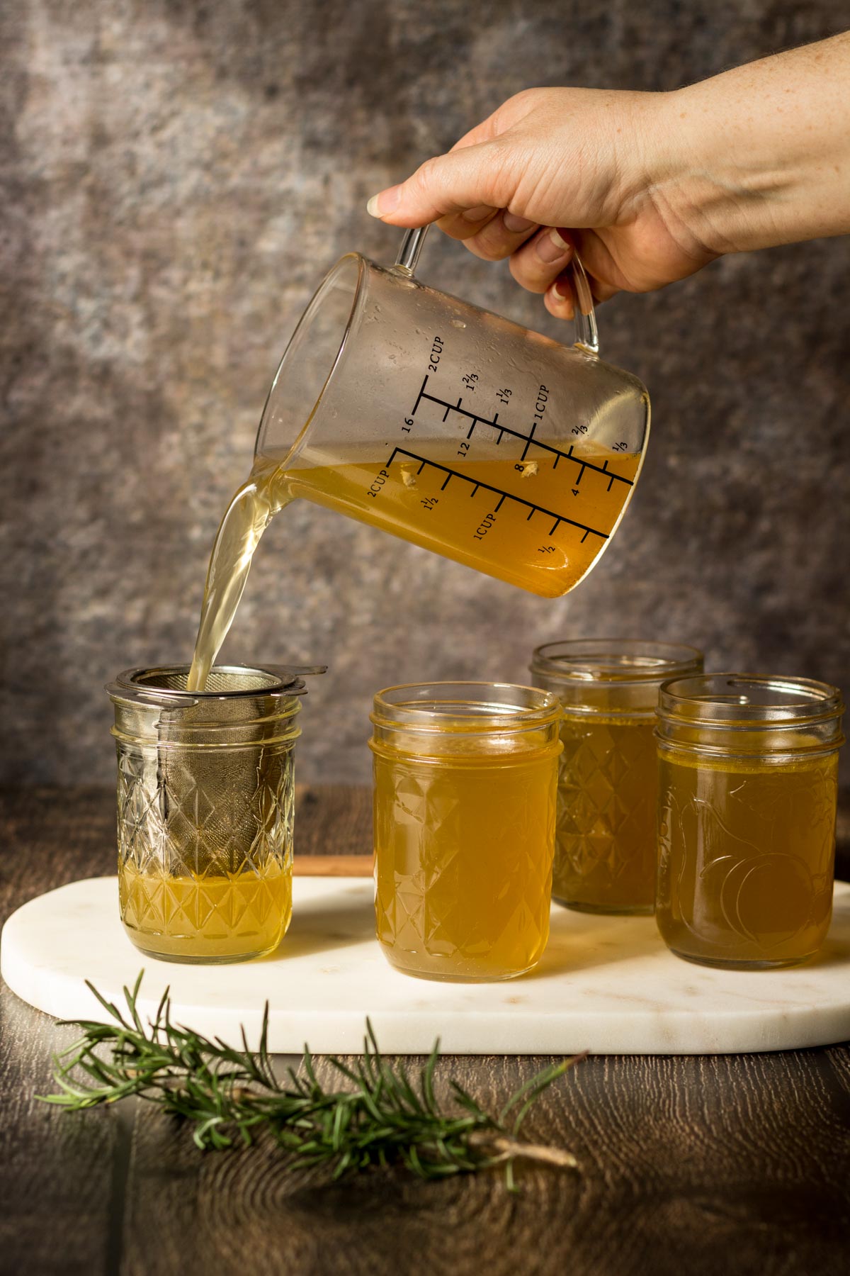 chicken stock poured into a mason jar