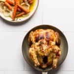Roasted chicken in a pan with vegetables