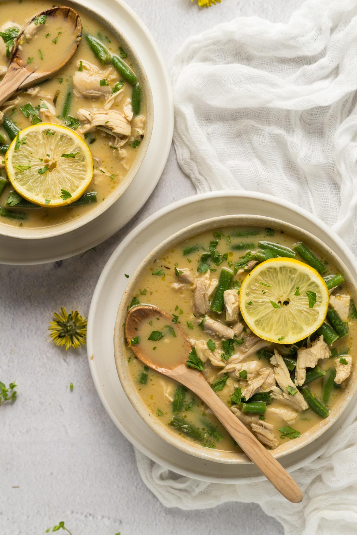 Chicken soup with lemon in bowls