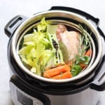 Vegetables and chicken bones in an instant pot