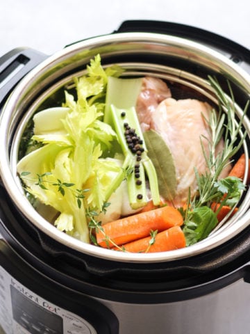 Vegetables and chicken bones in an instant pot