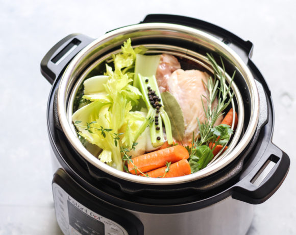 Vegetables and chicken bones in an instant pot