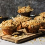 banana walnut muffins on a wooden cutting board