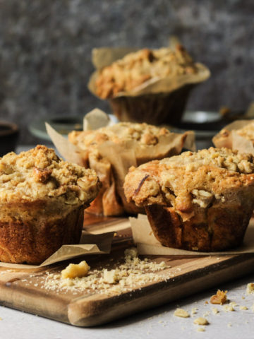 banana walnut muffins on a wooden cutting board