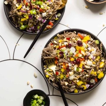 Soba Noodle Salad on plates with utensils