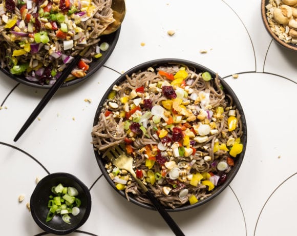 Cold Soba Noodle Salad on black plates with black cutlery