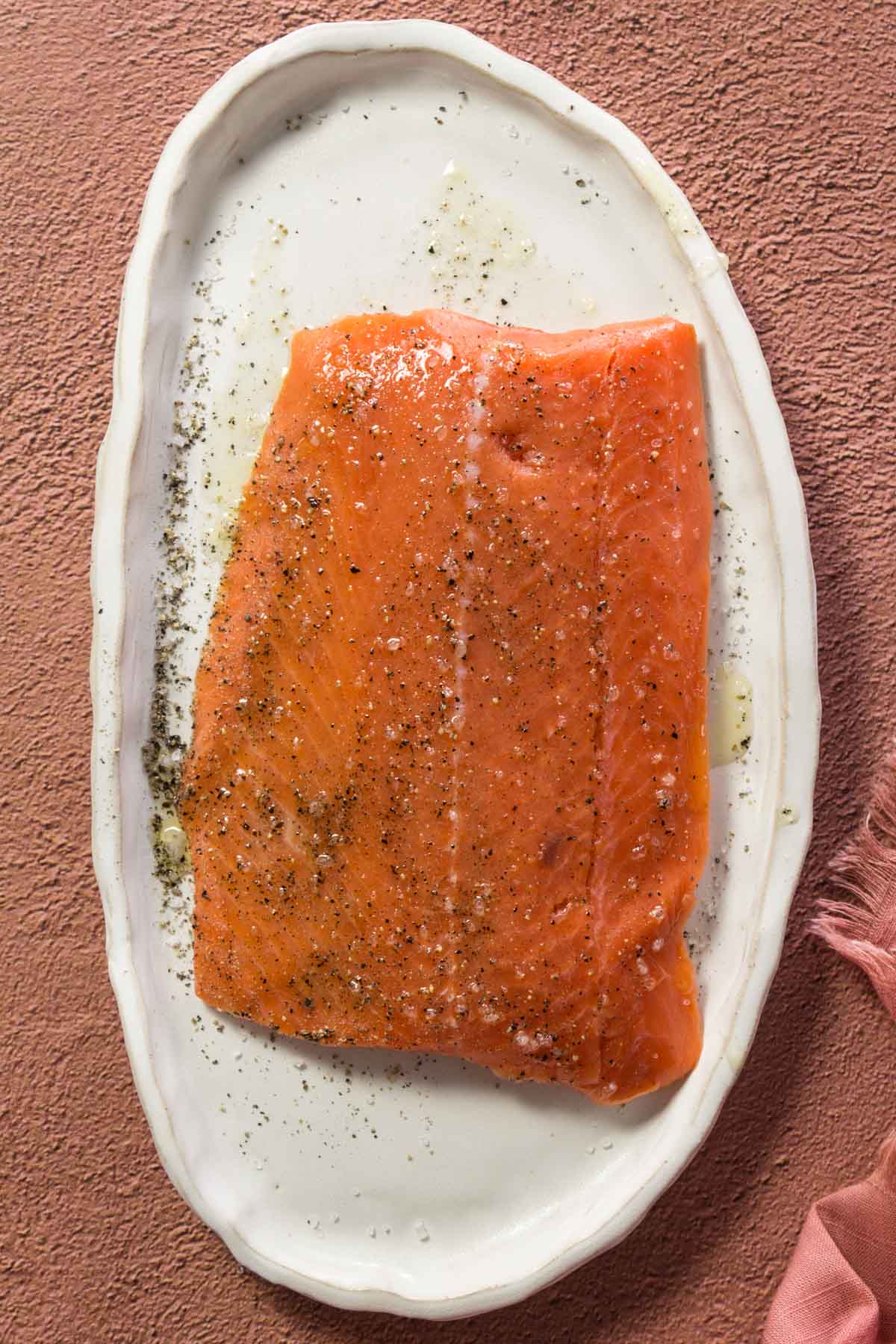 Seasoned Sockeye salmon on a white plate