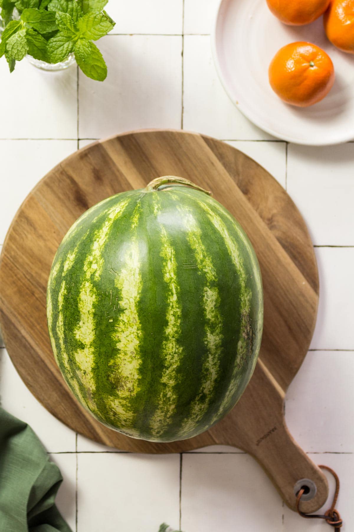 Whole watermelon on a wooden board