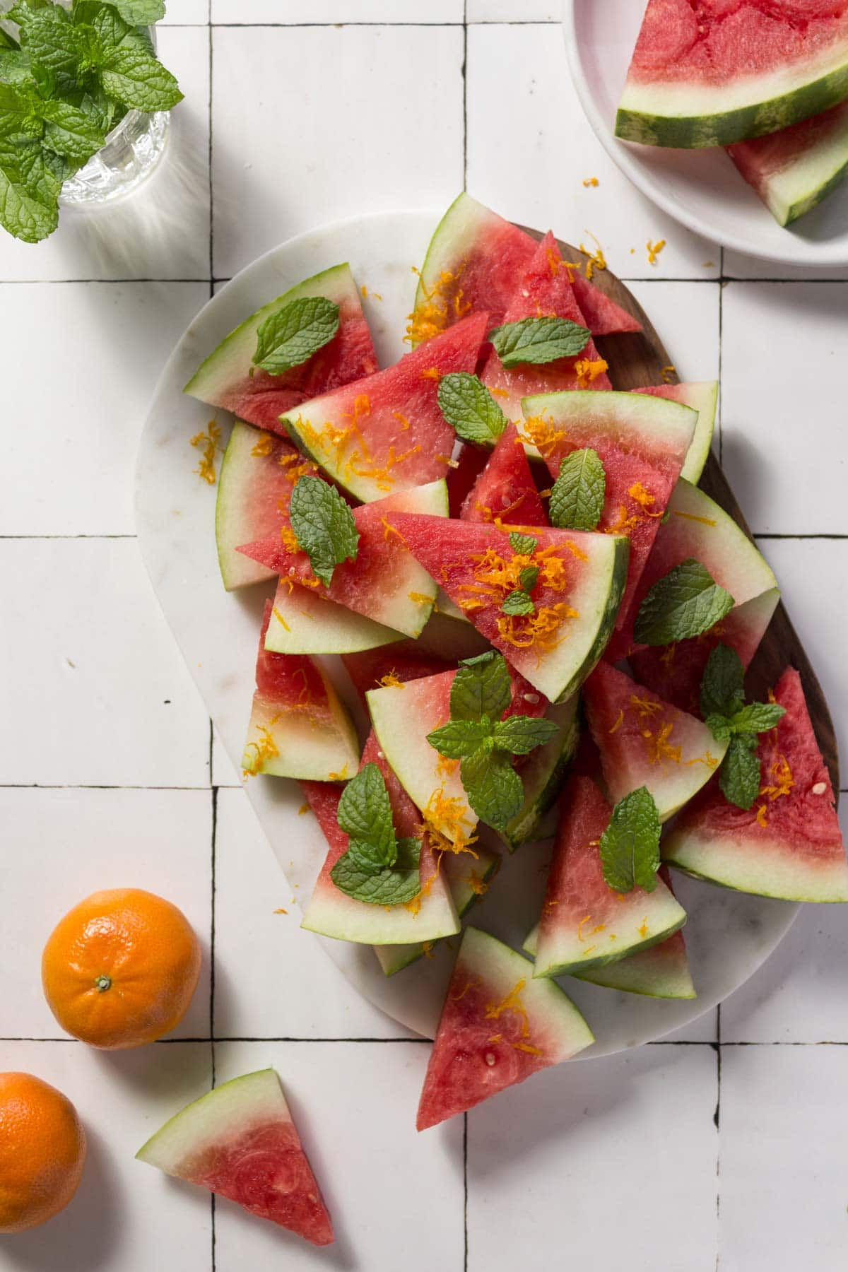 Watermelon salad with mint on a marble board