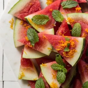Watermelon triangles with mint on a plate