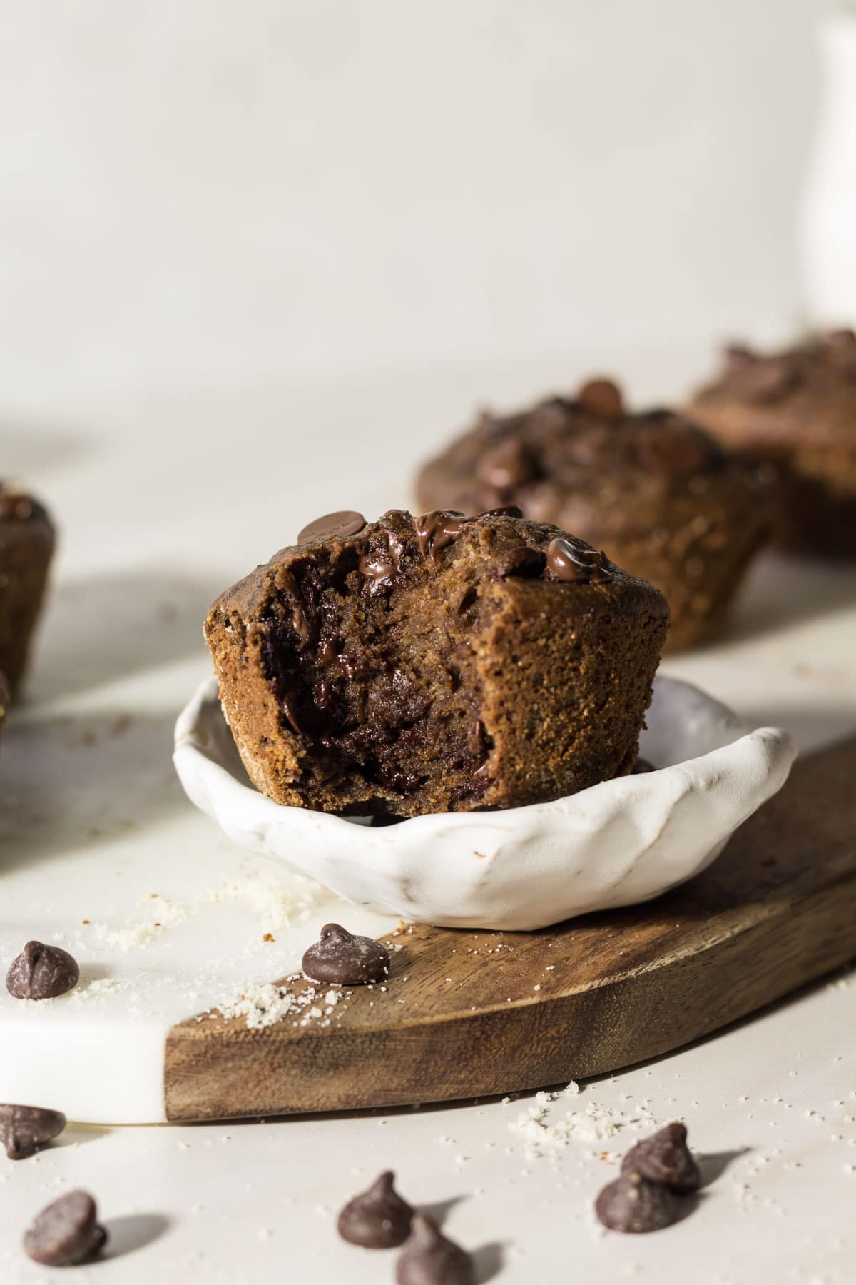 Double chocolate chip muffin with a bite taken out