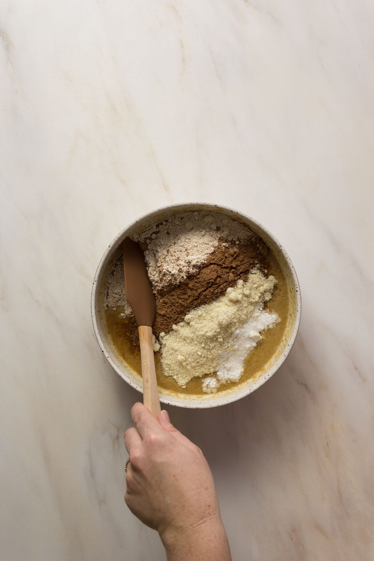 Double chocolate chip muffin batter in a bowl stirred