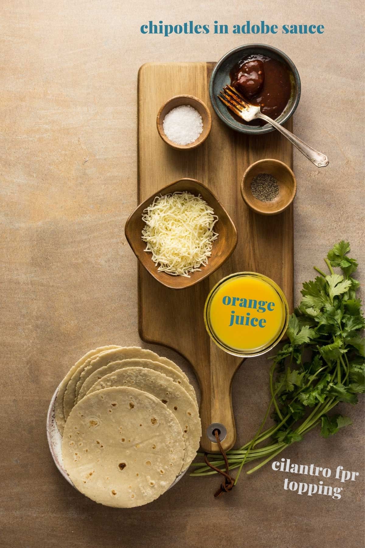 Chipotle orange taco ingredients on a wooden board