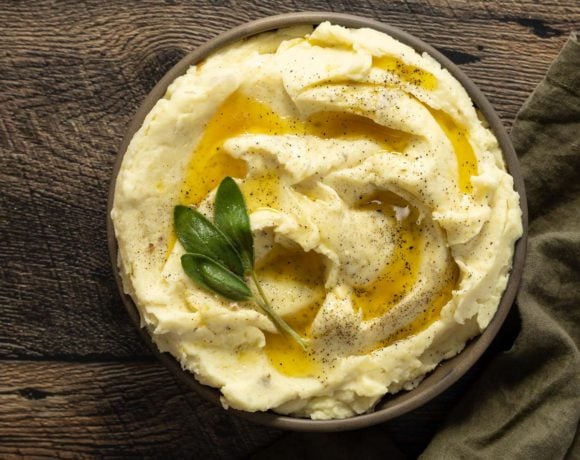 Créme fraîche mashed potatoes in a bowl with melted butter