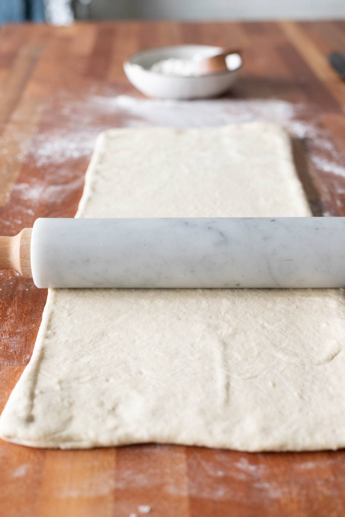 dough rolled out with a marble rolling pin