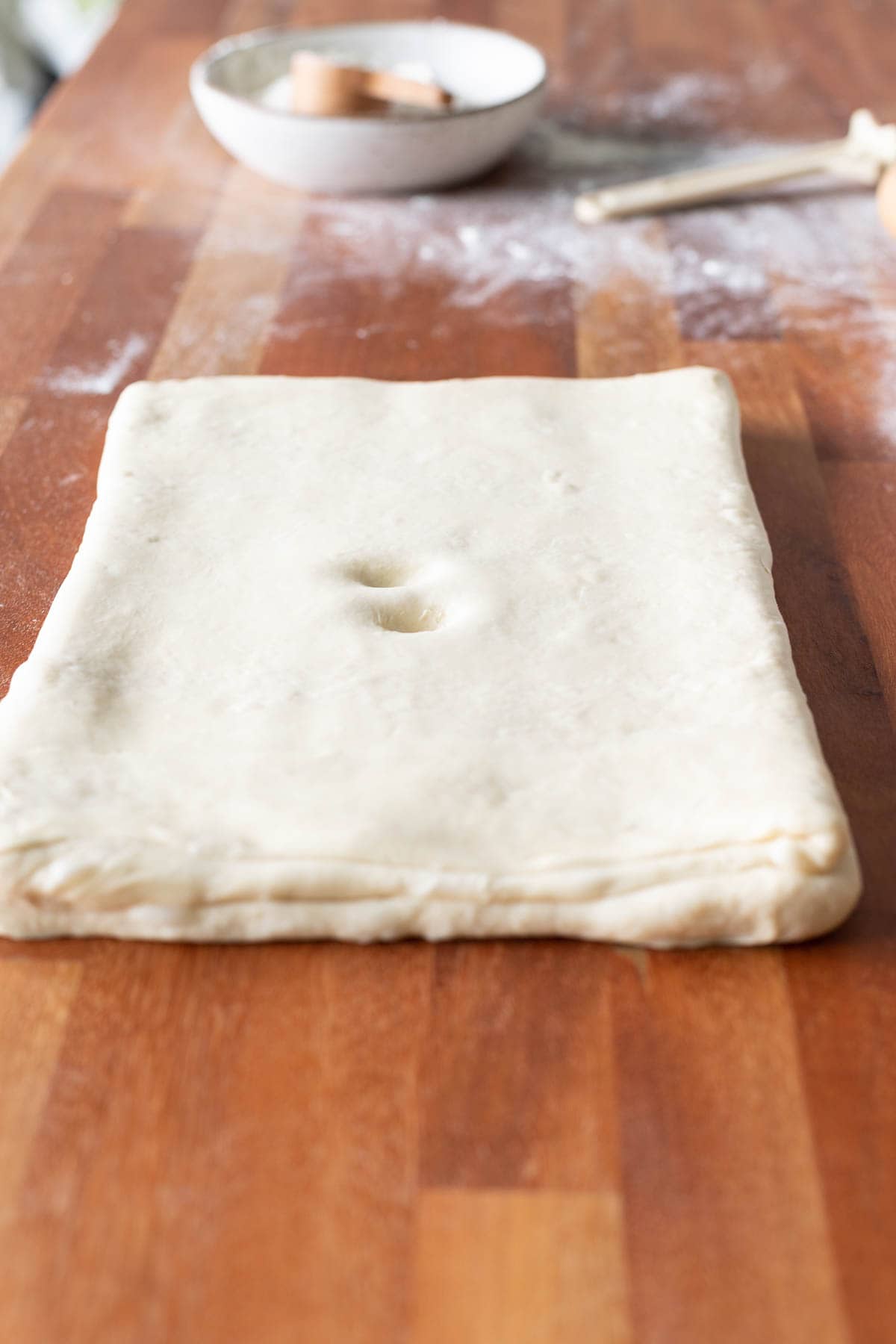 Croissant dough with two finger indentions on top
