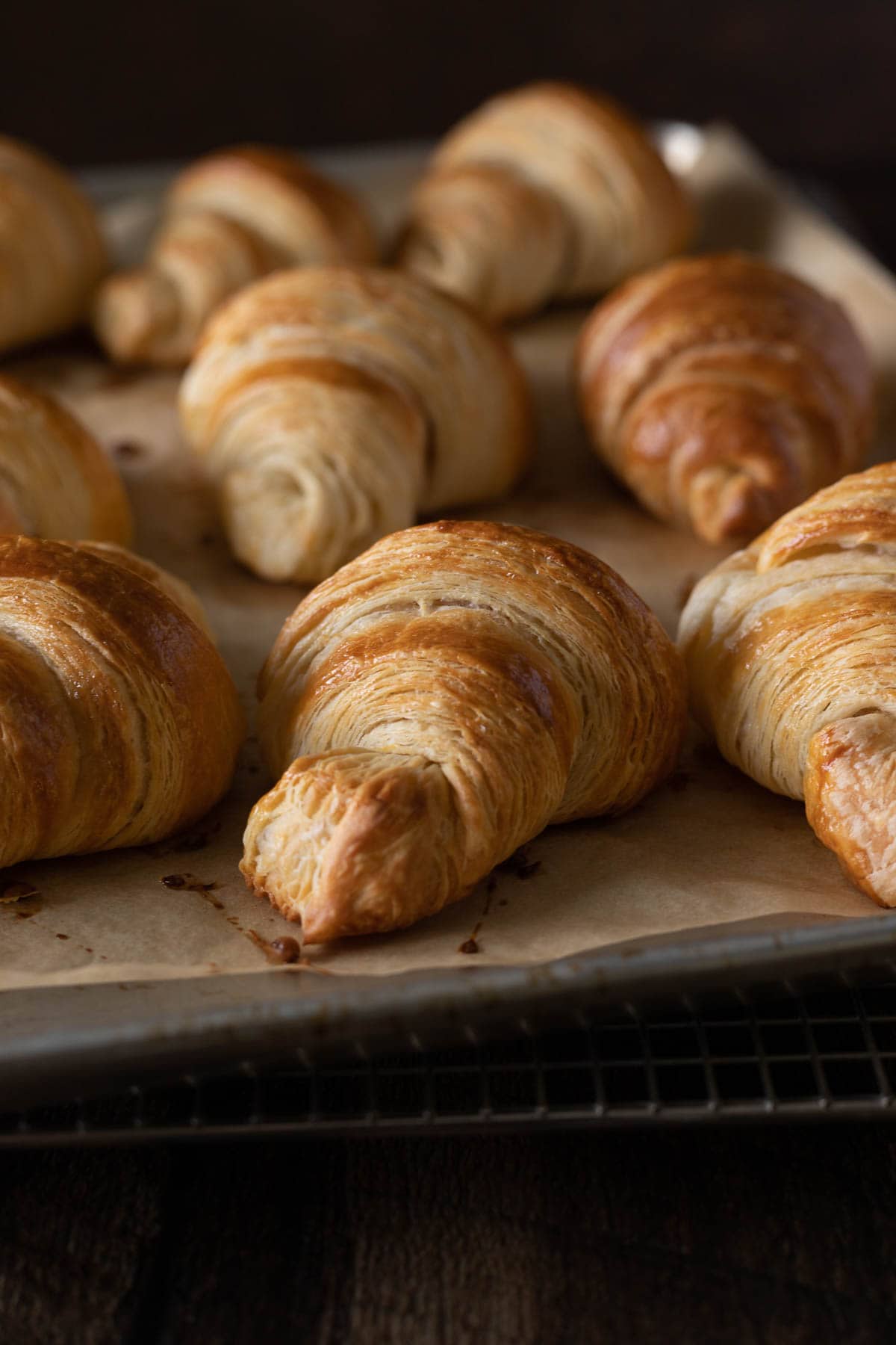 Croissant layers up close on a sheet pan