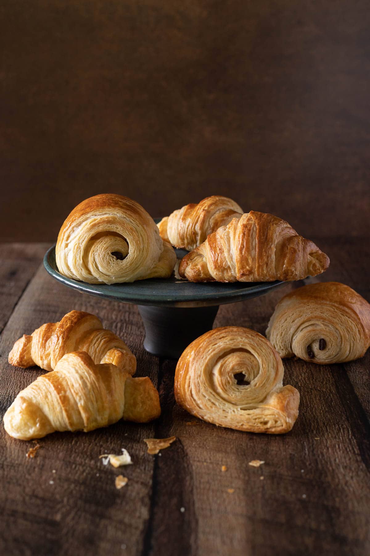 French croissants and chocolate croissants on a plate