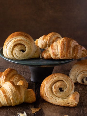 A black plate of French Croissants