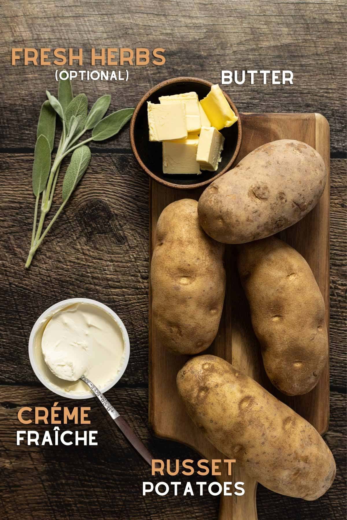 Potatoes. créme fraîche, butter, and sage on a cutting board