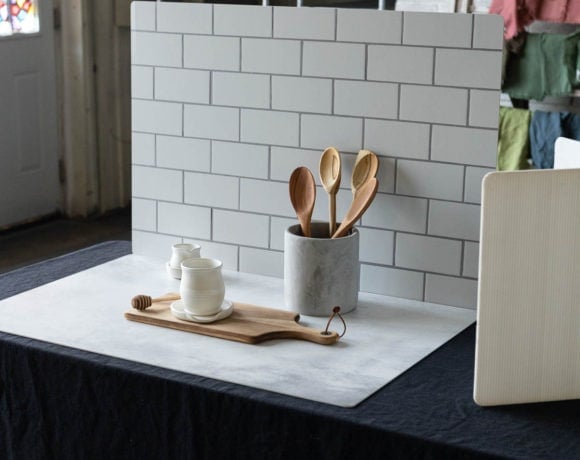 Photography backdrops standing up with a kitchen canister and wooden spoons