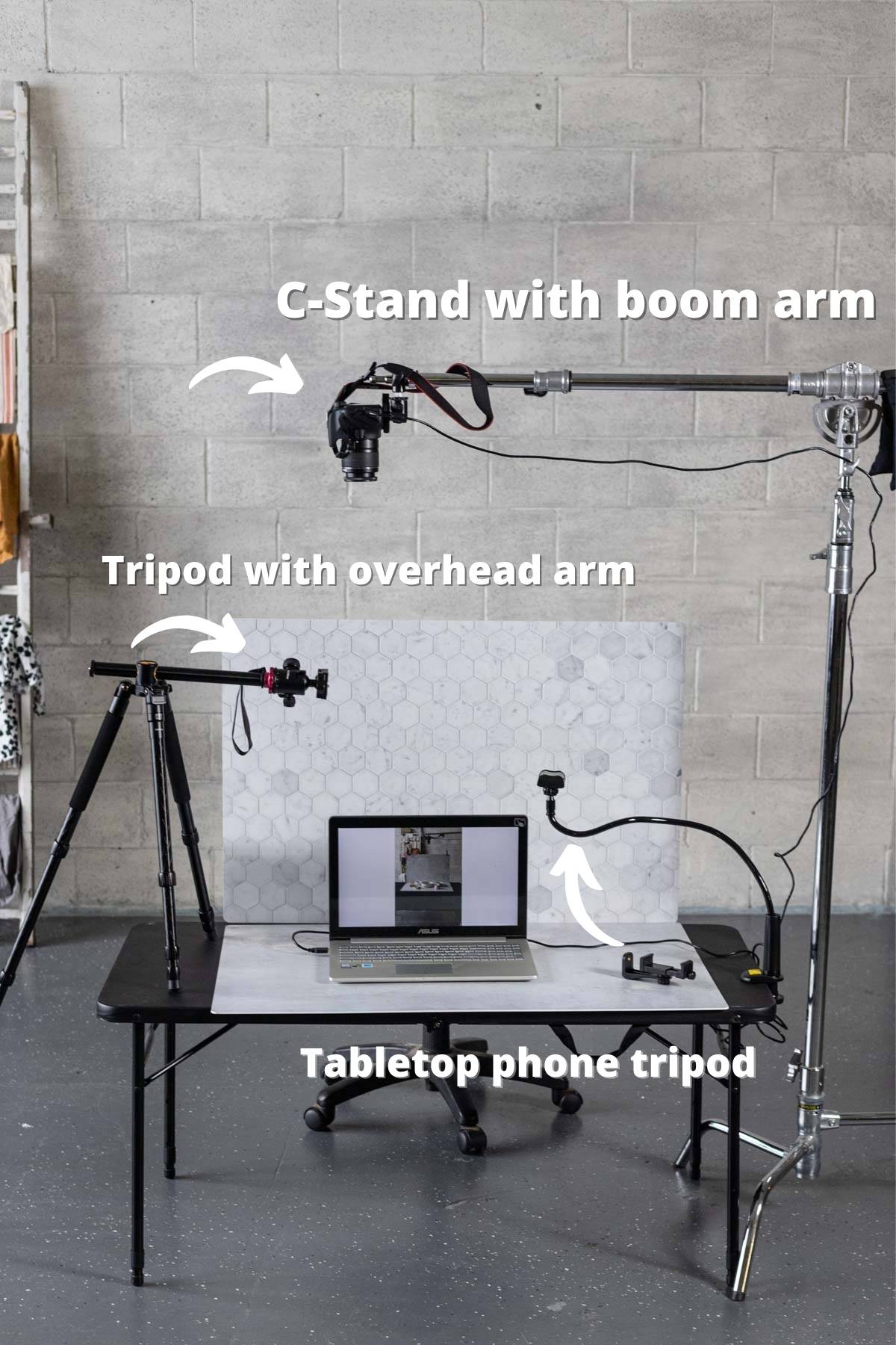 Tripods with photo backdrops and a computer