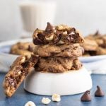 Double chocolate chip cookies stacked on a bowl