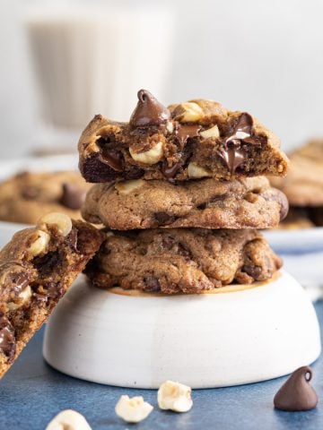 Double chocolate chip cookies stacked on a bowl