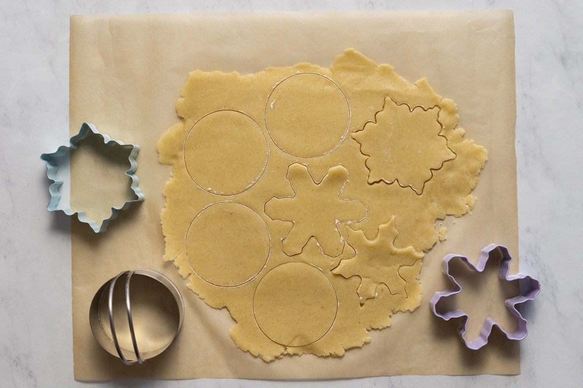 Almond shortbread cookie dough with cookie cutters